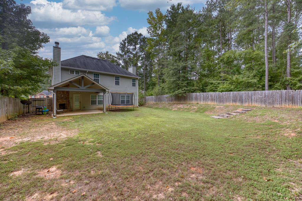 98 Valley Bluff Drive Hamilton, GA 31811 - Photo 33 of 35 a view of house with backyard and deck