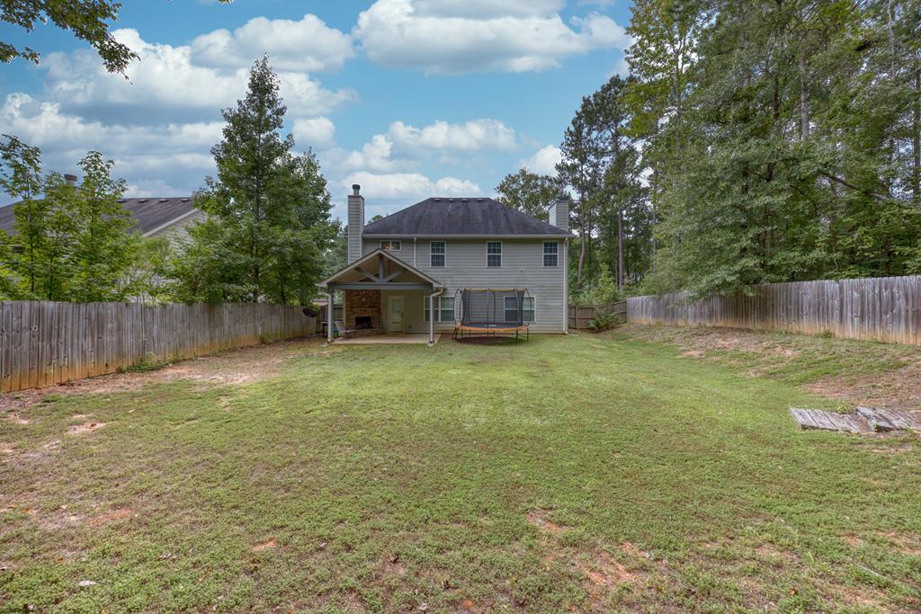 98 Valley Bluff Drive Hamilton, GA 31811 - Photo 34 of 35 a house view with a garden space