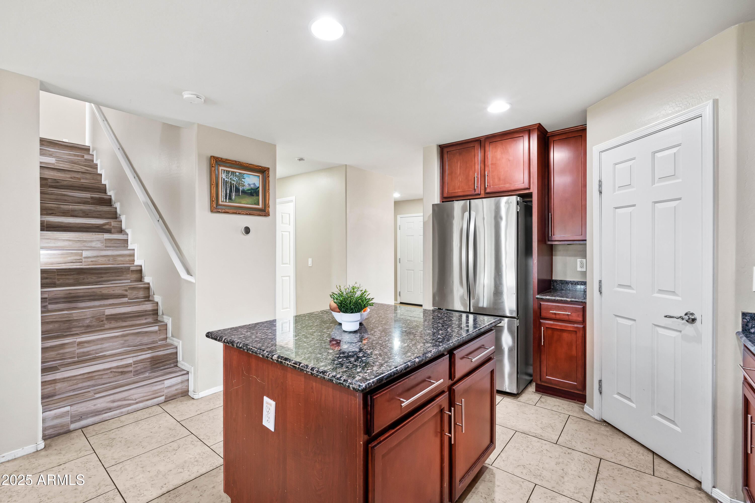 6525 West Georgetown Way Florence, AZ 85132 - Photo 17 of 82 a kitchen with stainless steel appliances granite countertop a stove and refrigerator