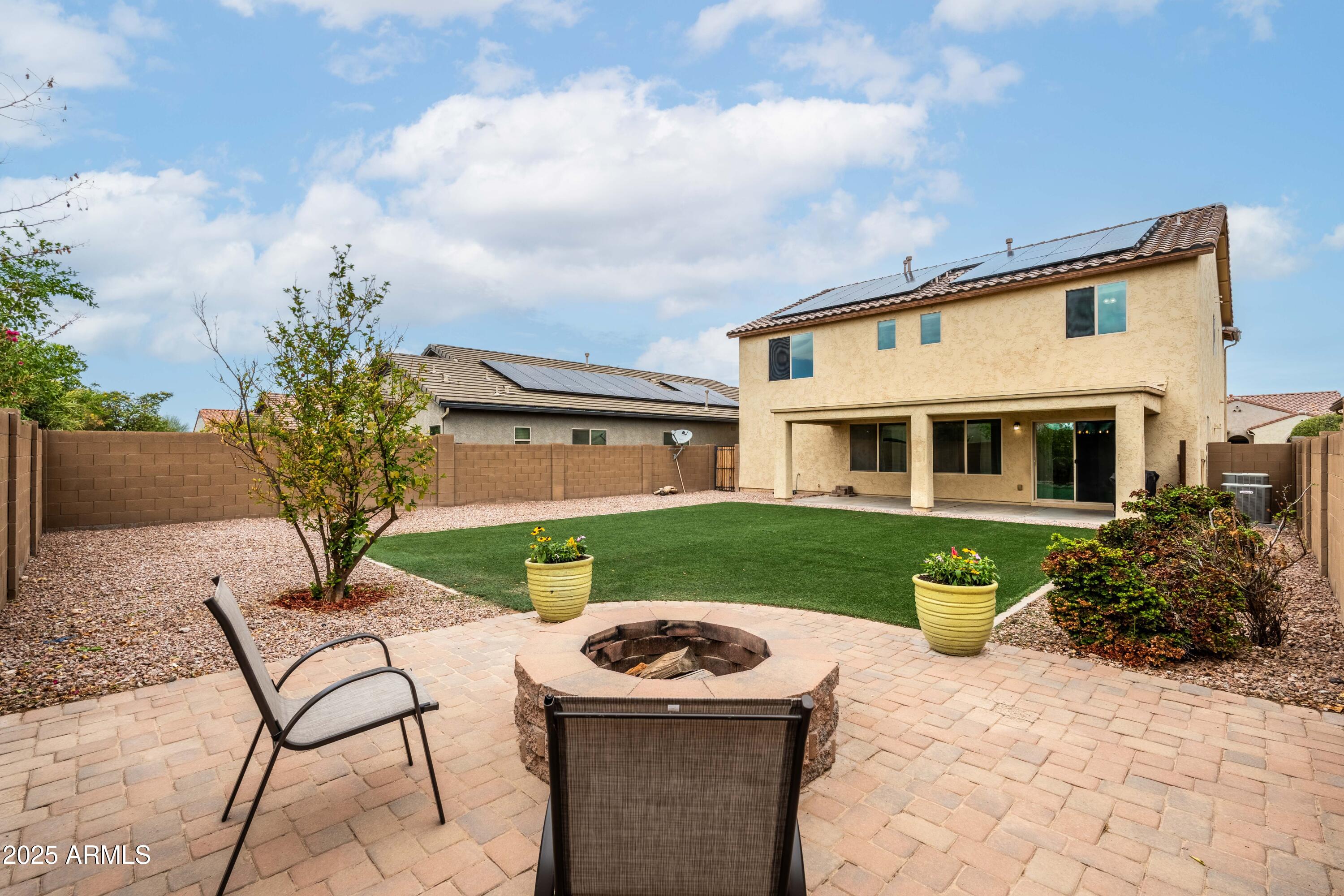 6525 West Georgetown Way Florence, AZ 85132 - Photo 2 of 82 a front view of a house with garden