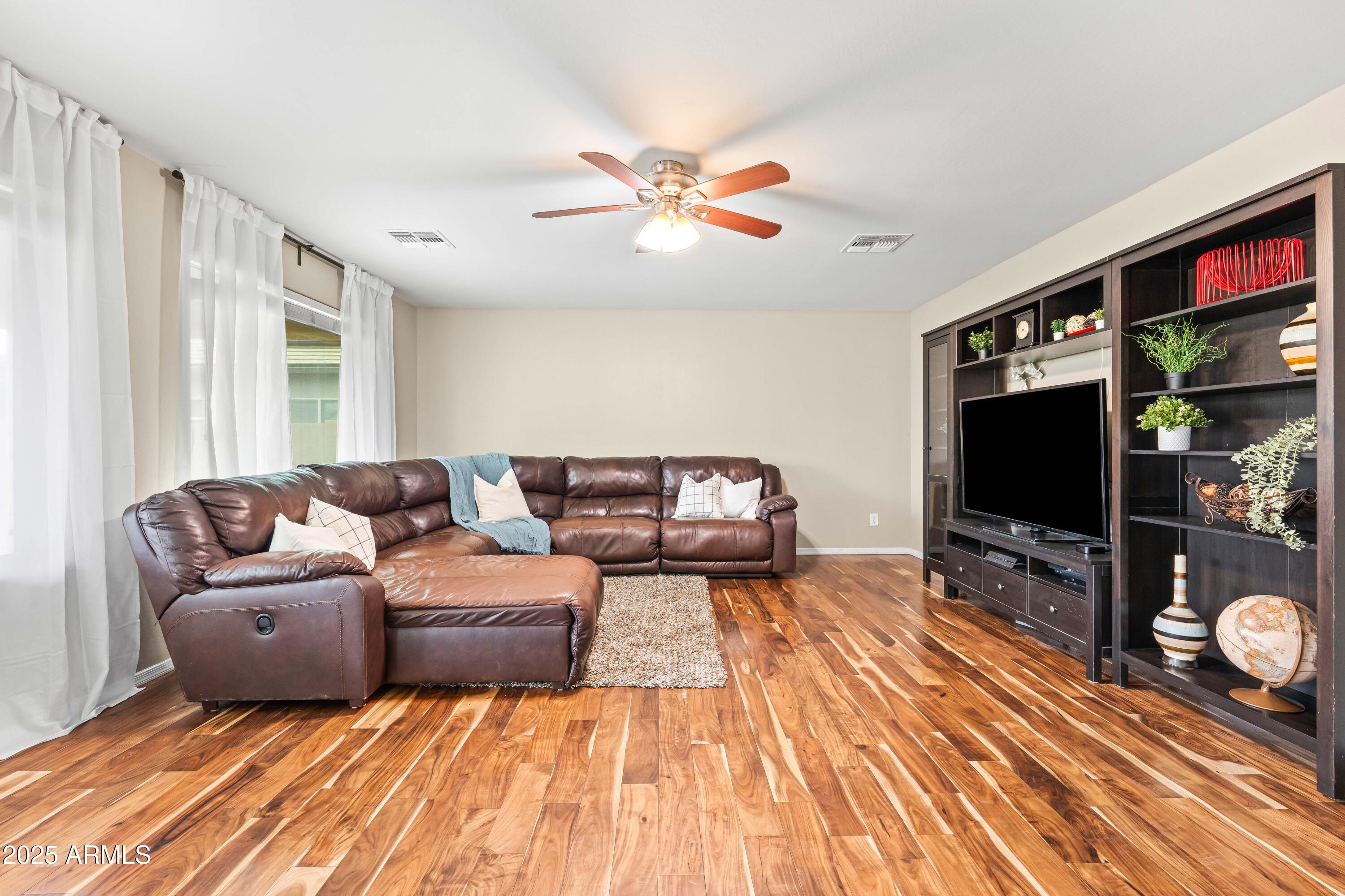 6525 West Georgetown Way Florence, AZ 85132 - Photo 24 of 82 a living room with furniture and a flat screen tv