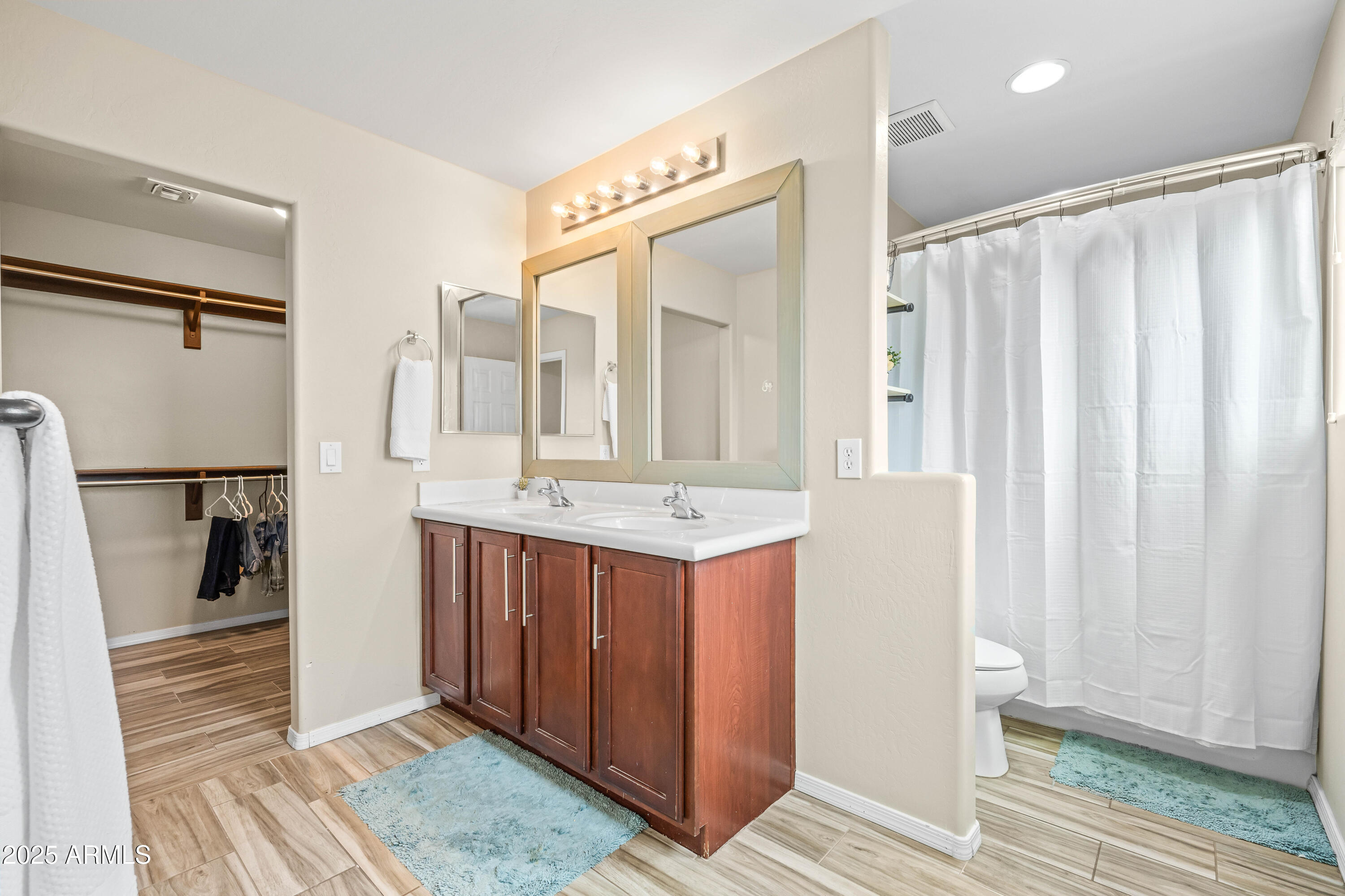 6525 West Georgetown Way Florence, AZ 85132 - Photo 36 of 82 a bathroom with a double vanity sink and mirror