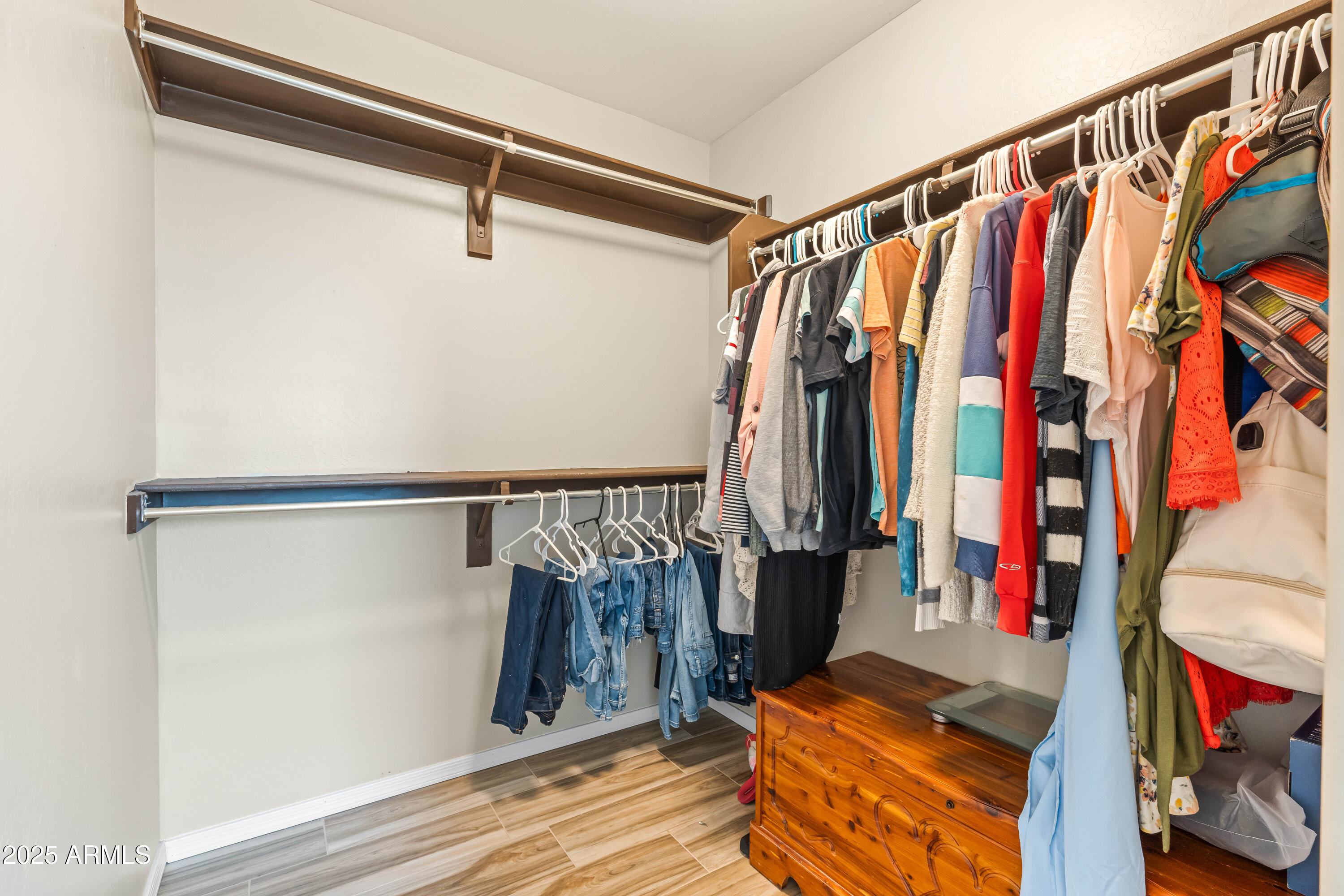 6525 West Georgetown Way Florence, AZ 85132 - Photo 39 of 82 a view of walk in closet with clothes and shoes