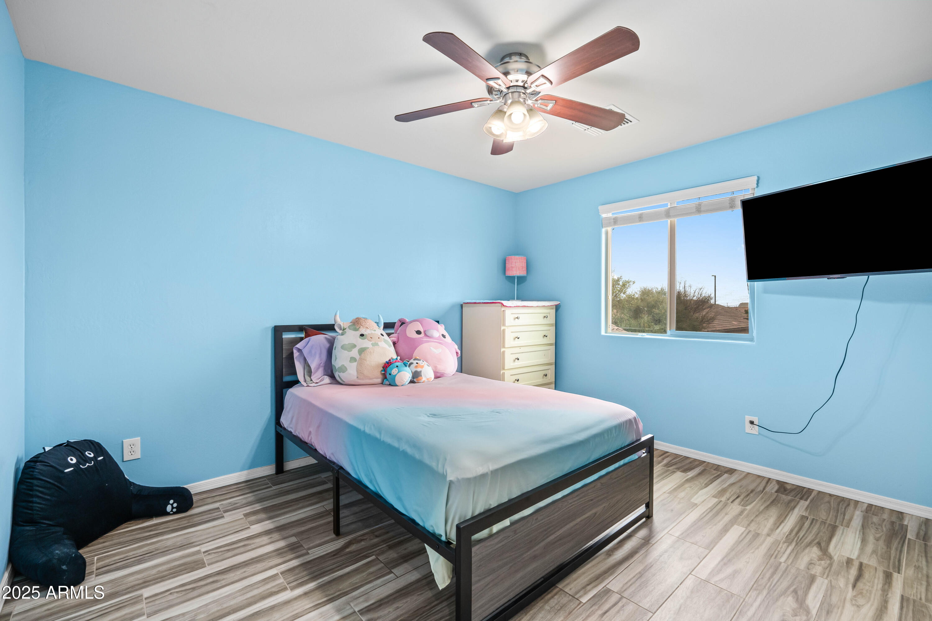 6525 West Georgetown Way Florence, AZ 85132 - Photo 44 of 82 a bedroom with a bed and a flat screen tv