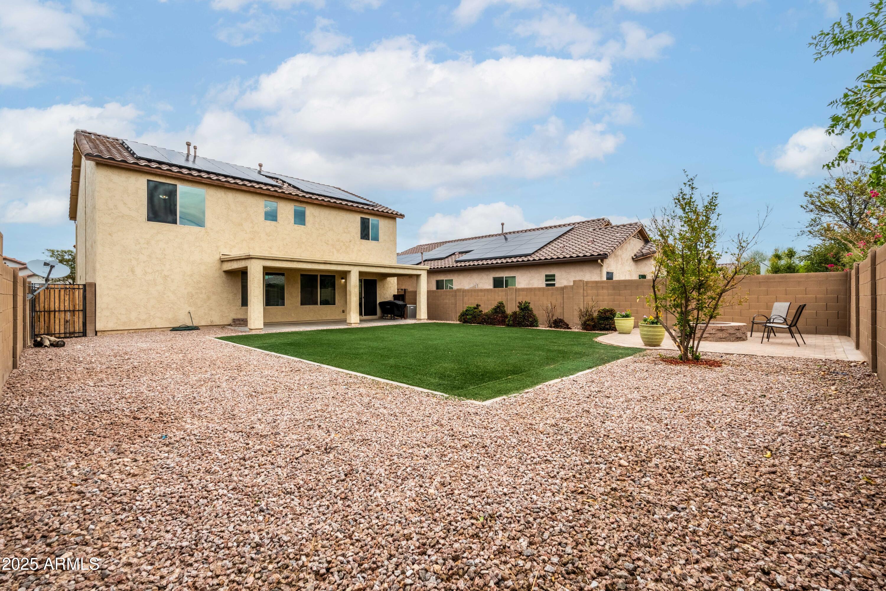 6525 West Georgetown Way Florence, AZ 85132 - Photo 51 of 82 a front view of a house with a yard and garage