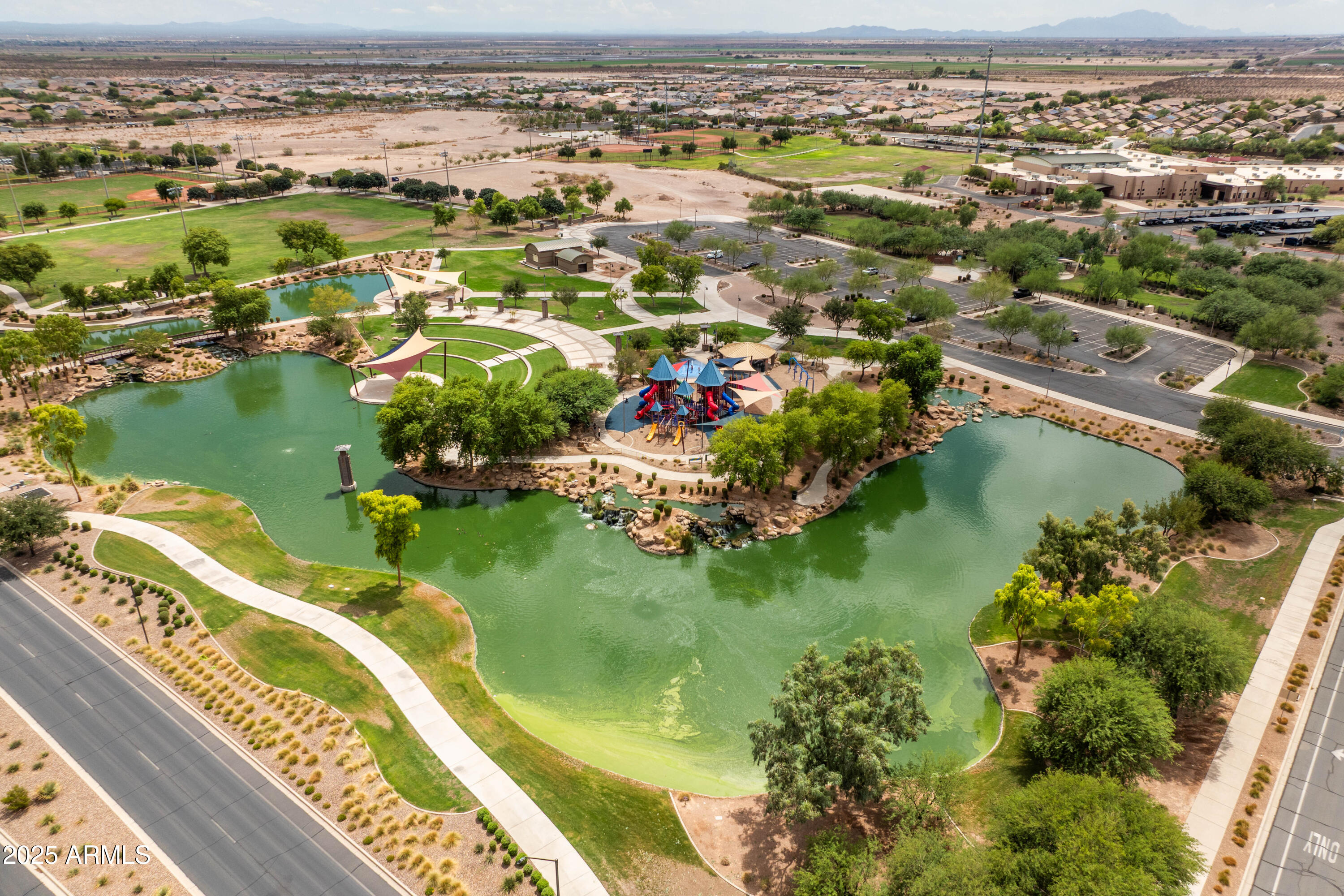 6525 West Georgetown Way Florence, AZ 85132 - Photo 78 of 82 an aerial view of residential houses with outdoor space and lake view