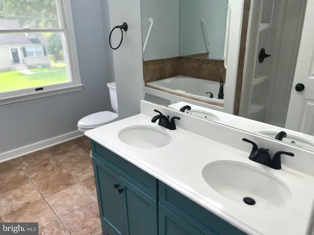 a bathroom with a bathtub and shower
