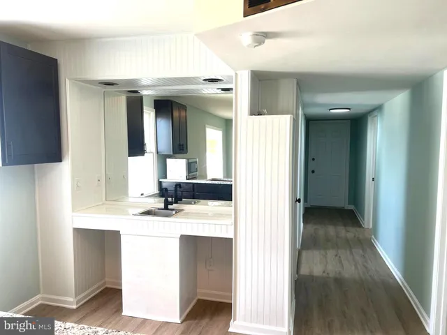 a view of a fireplace with wooden floor
