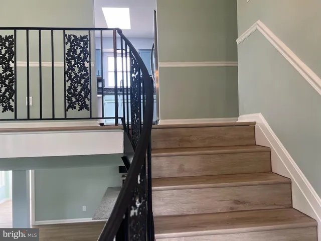 a kitchen with stainless steel appliances a stove a microwave and a refrigerator