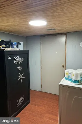 a room with furniture and musical instruments