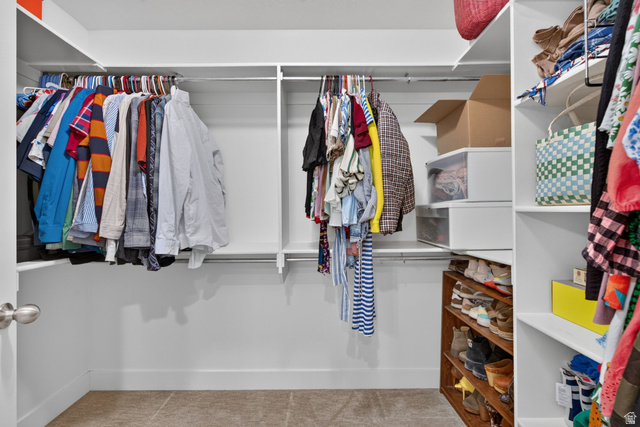 1263 East 1200th South Springville, UT 84663 - Photo 21 of 60 White shelving system with multiple hanging rods, integrated shelving units, and a built-in wooden shoe rack