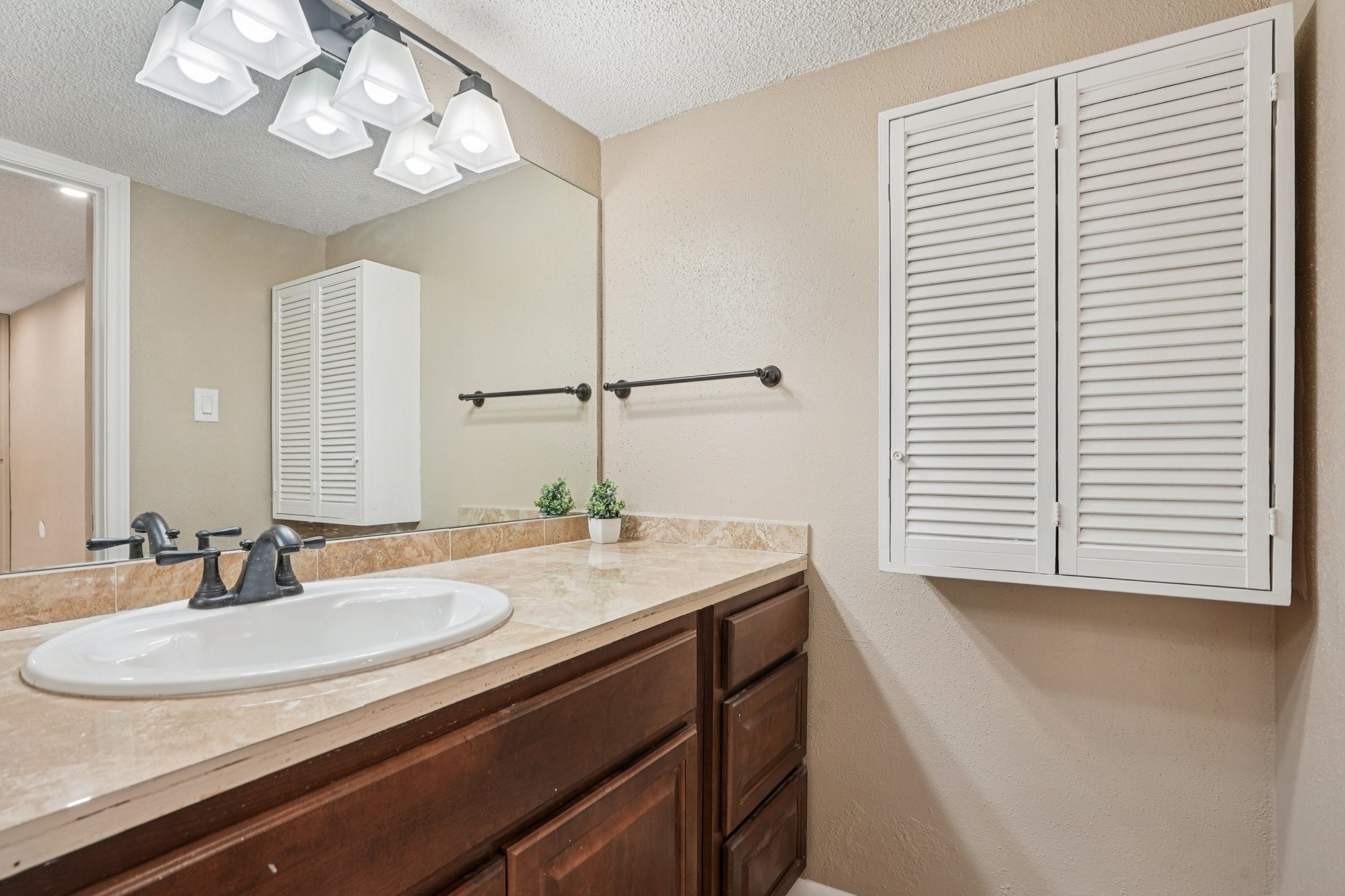 2800 Jeanetta Street, Unit 203 Houston, TX 77063 - Photo 21 of 28 a bathroom with a sink and a mirror