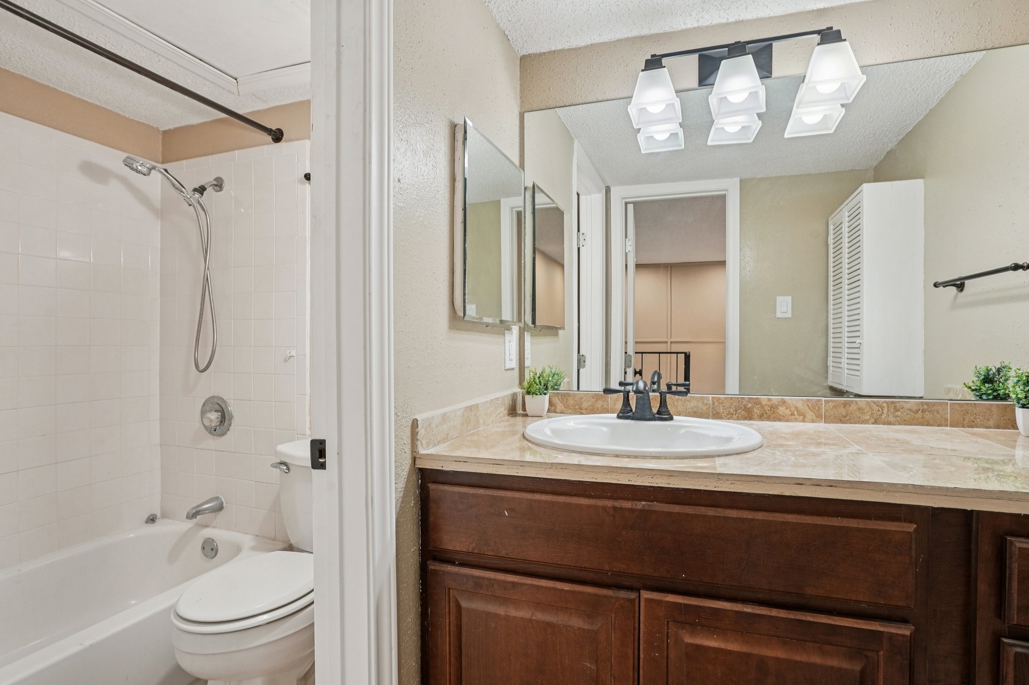2800 Jeanetta Street, Unit 203 Houston, TX 77063 - Photo 22 of 28 a bathroom with a sink a toilet and shower