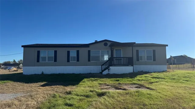 a house view with a garden space