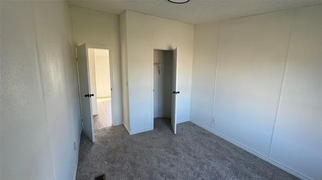 an empty room that has a mirror