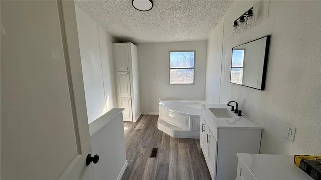 a bathroom with a sink a mirror and a toilet
