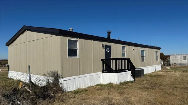a front view of a house with a garage