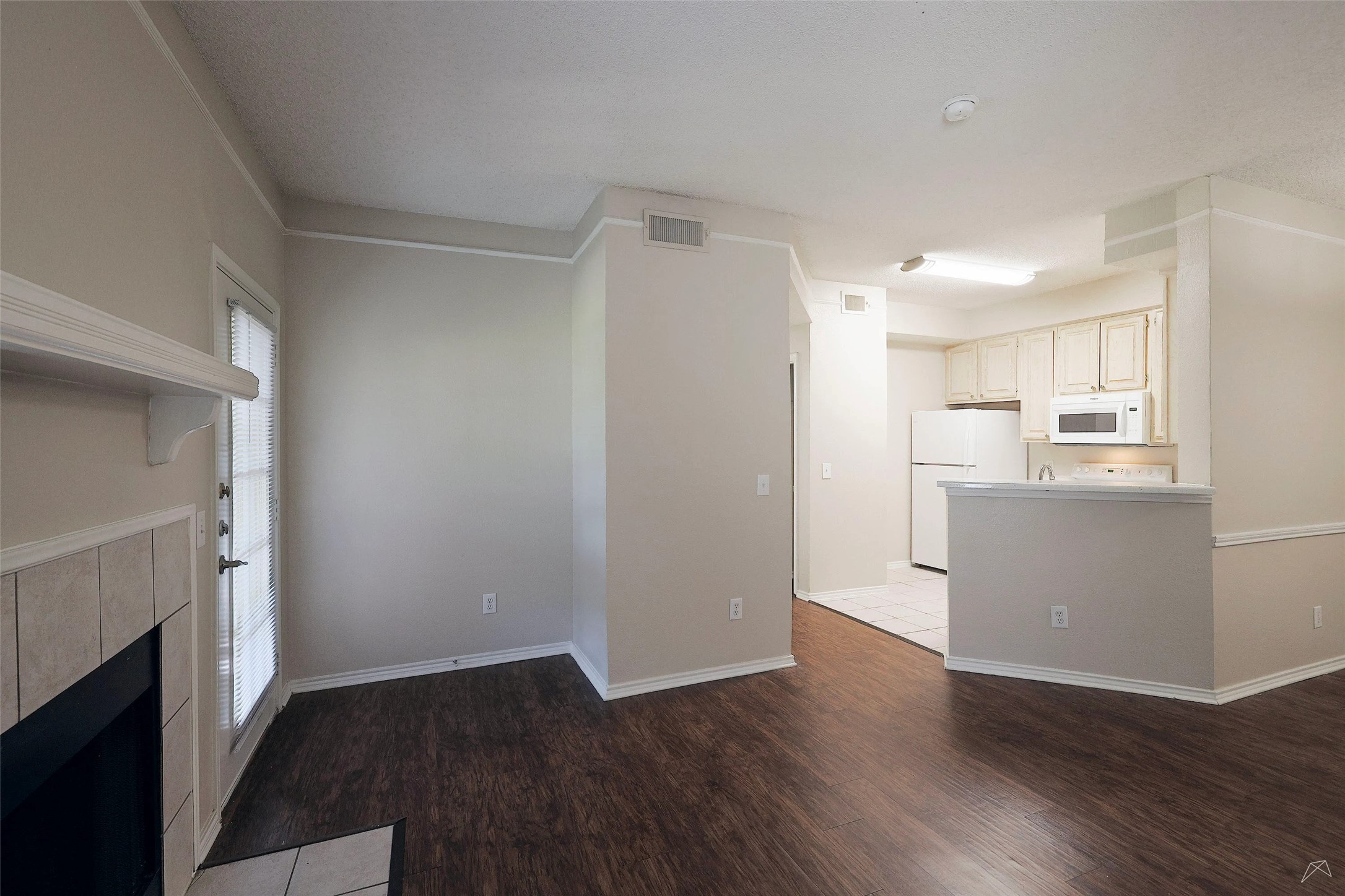 11908 Anderson Mill Road, Unit 331 Cedar Park, TX 78613 - Photo 6 of 24 a view of a kitchen with wooden floor and a kitchen