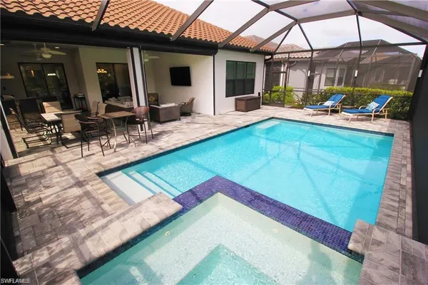 a view of a backyard with a patio and a garden