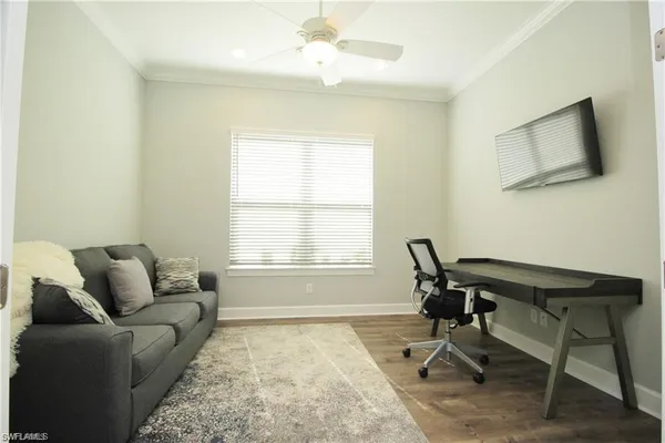 a work room with furniture and a window