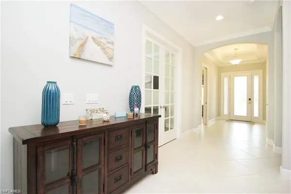 a view of a living room with furniture and wooden floor