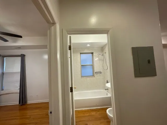 a bathroom with a bathtub and shower