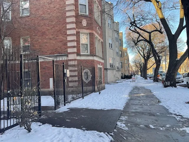 a view of a brick building with many windows