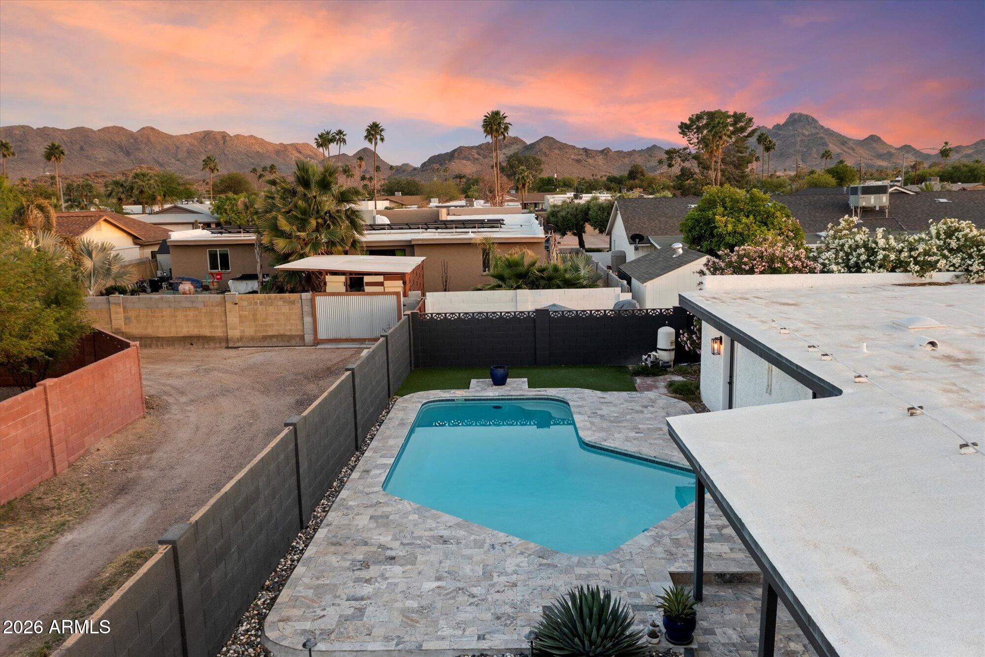 10245 North 34th Place Phoenix, AZ 85028 - Photo 20 of 26 a view of a terrace with a garden and wooden deck