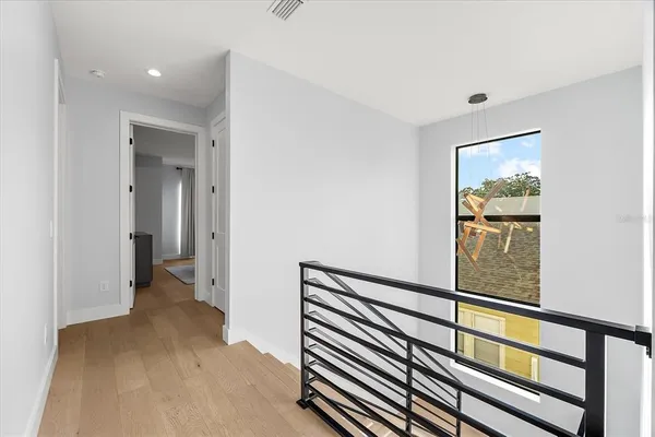 a bedroom with a bed couch and window