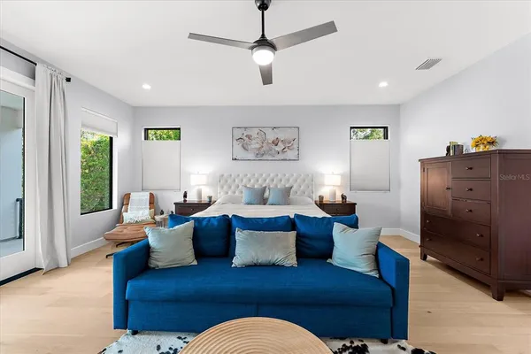 a view of a livingroom with workspace and a couch