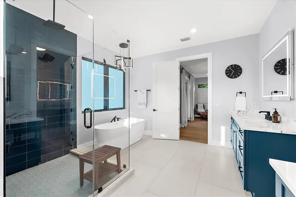 a view of a house with backyard sitting area and garden