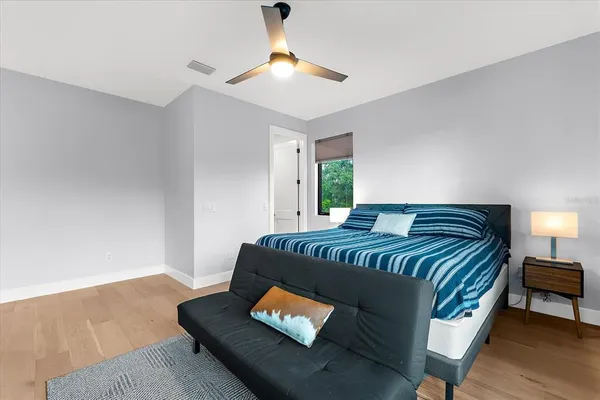 a view of a house with pool and sitting area