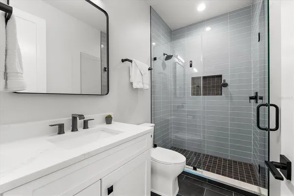 an aerial view of residential houses with city view