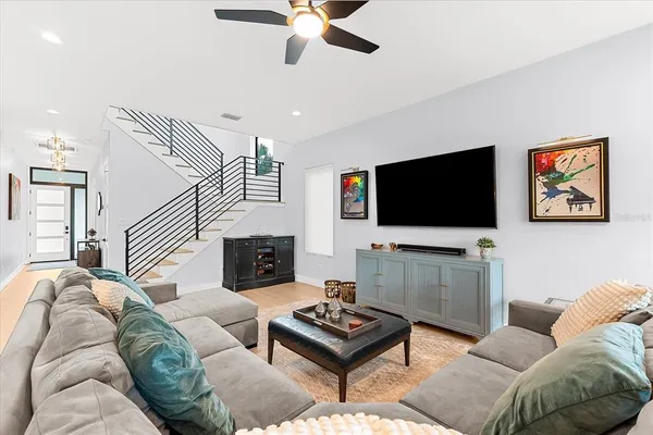 a living room with furniture and a large window