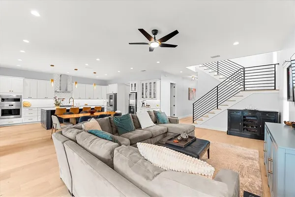 a large kitchen with a table and chairs