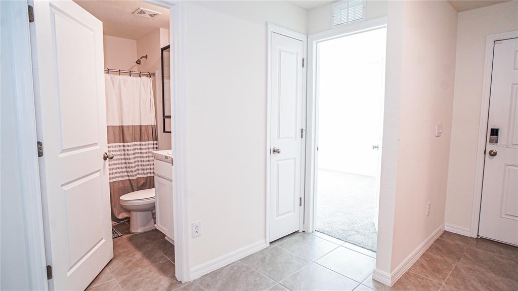 13253 Mylion Way Spring Hill, FL 34610 - Photo 13 of 31 a bathroom with a sink and a mirror