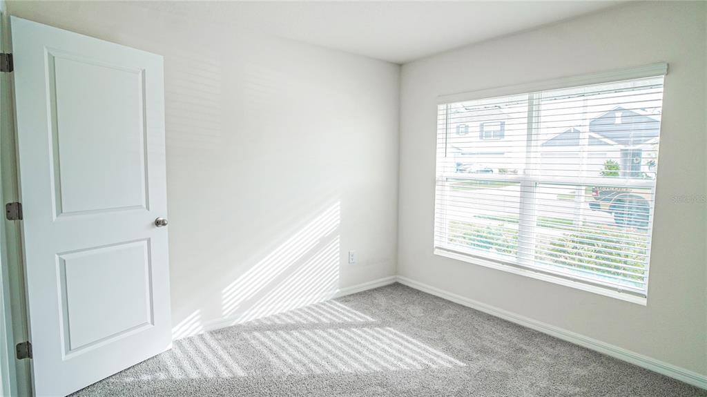 13253 Mylion Way Spring Hill, FL 34610 - Photo 14 of 31 a view of an empty room with a window