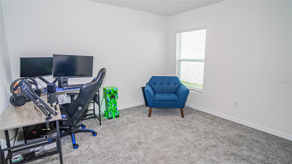 13253 Mylion Way Spring Hill, FL 34610 - Photo 17 of 31 a room with furniture and a window