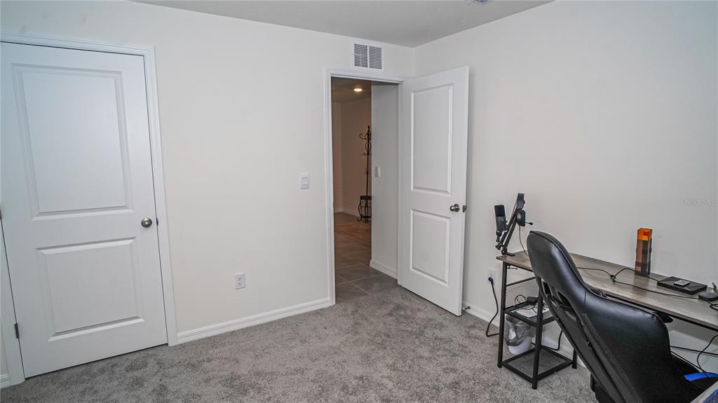 13253 Mylion Way Spring Hill, FL 34610 - Photo 18 of 31 a view of a workspace with furniture and closet
