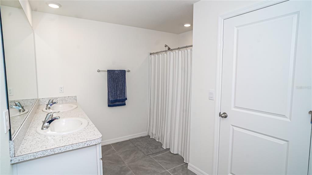 13253 Mylion Way Spring Hill, FL 34610 - Photo 22 of 31 a bathroom with a sink and a tub