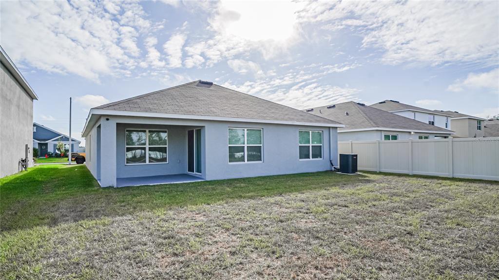 13253 Mylion Way Spring Hill, FL 34610 - Photo 29 of 31 a view of a house with a yard