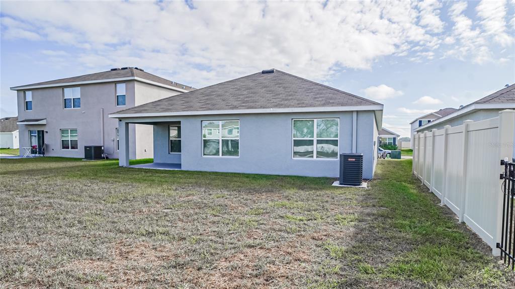 13253 Mylion Way Spring Hill, FL 34610 - Photo 30 of 31 a view of a house with a yard