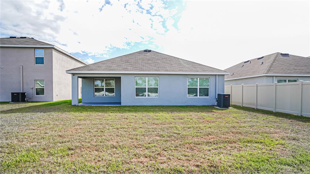 13253 Mylion Way Spring Hill, FL 34610 - Photo 31 of 31 a view of a house with garden