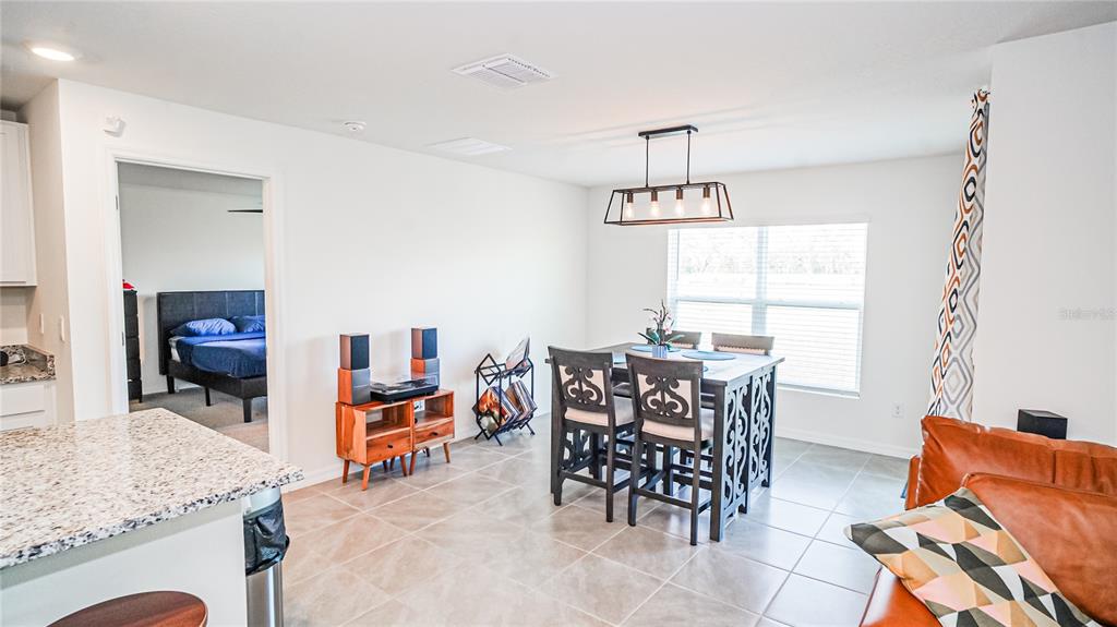 13253 Mylion Way Spring Hill, FL 34610 - Photo 6 of 31 a dining room with furniture and window