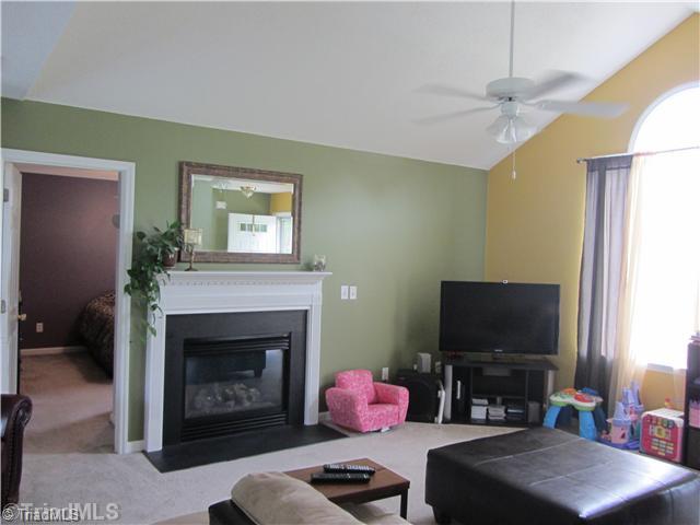 598 Bailey Road Madison, NC 27025 - Photo 4 of 6 Living Room. Living room with fireplace, vaulted ceilings