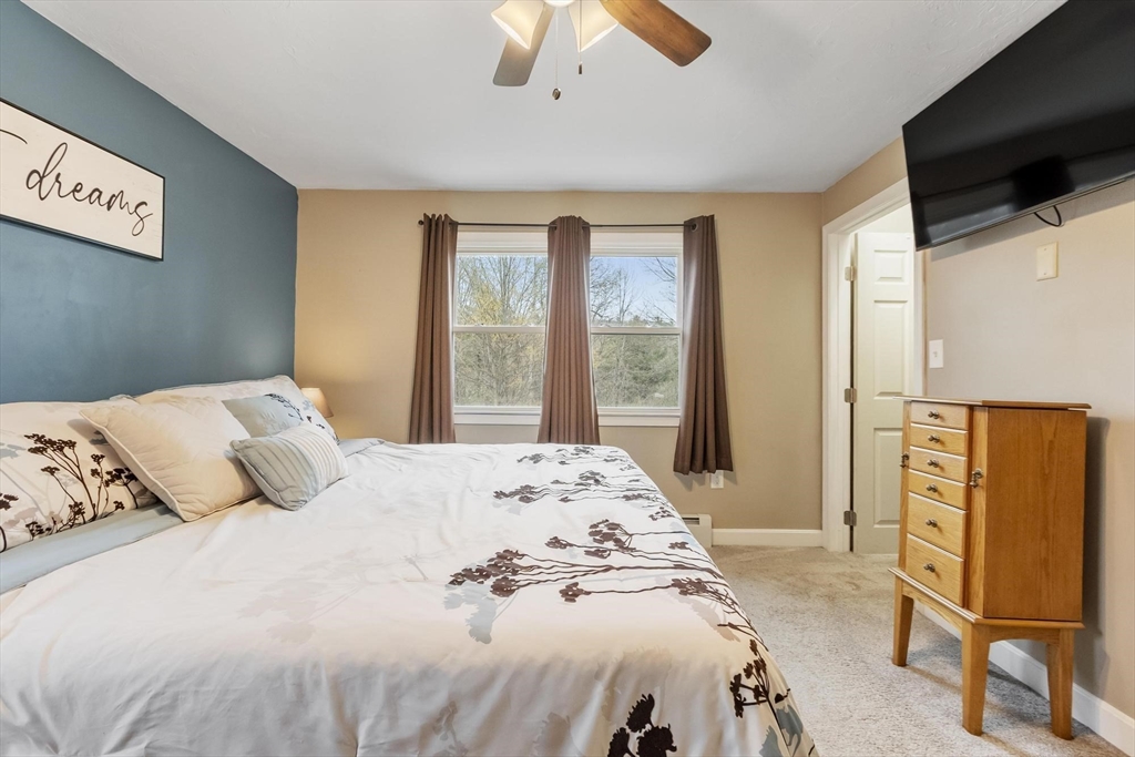 101 Williams Road Ashburnham, MA 01430 - Photo 31 of 42 a bedroom with a bed and wooden floor