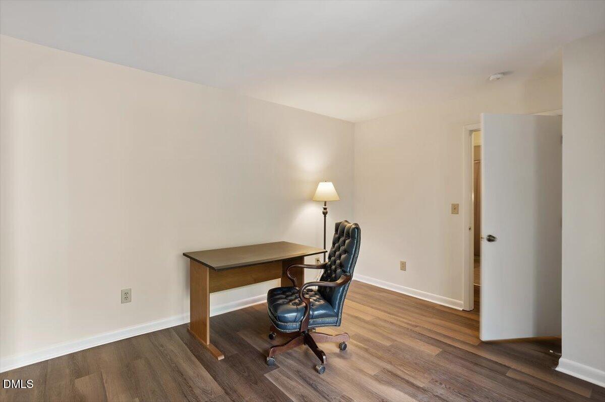 163 Springberry Lane Chapel Hill, NC 27517 - Photo 23 of 32 a workspace with furniture and wooden floor