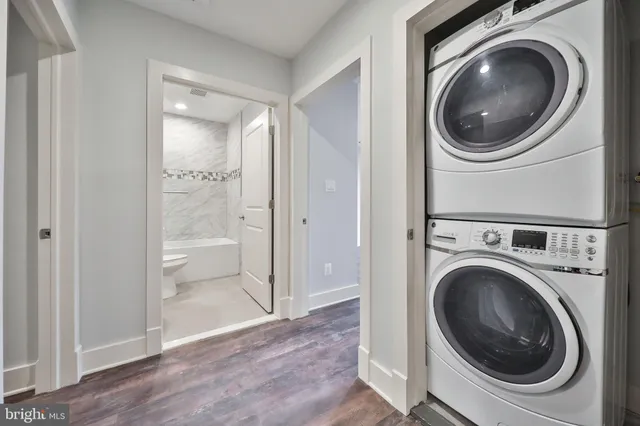 a view of a hallway with washer and dryer
