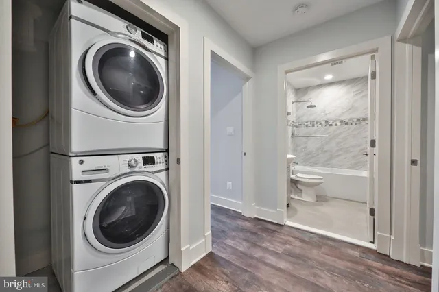 a view of a hallway with washer and dryer