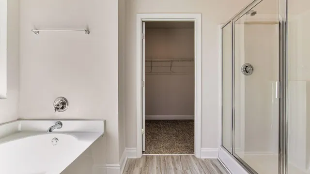 a bathroom with a tub and sink